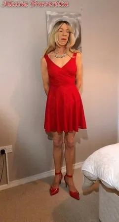    alessia travestita in flirty red dress         