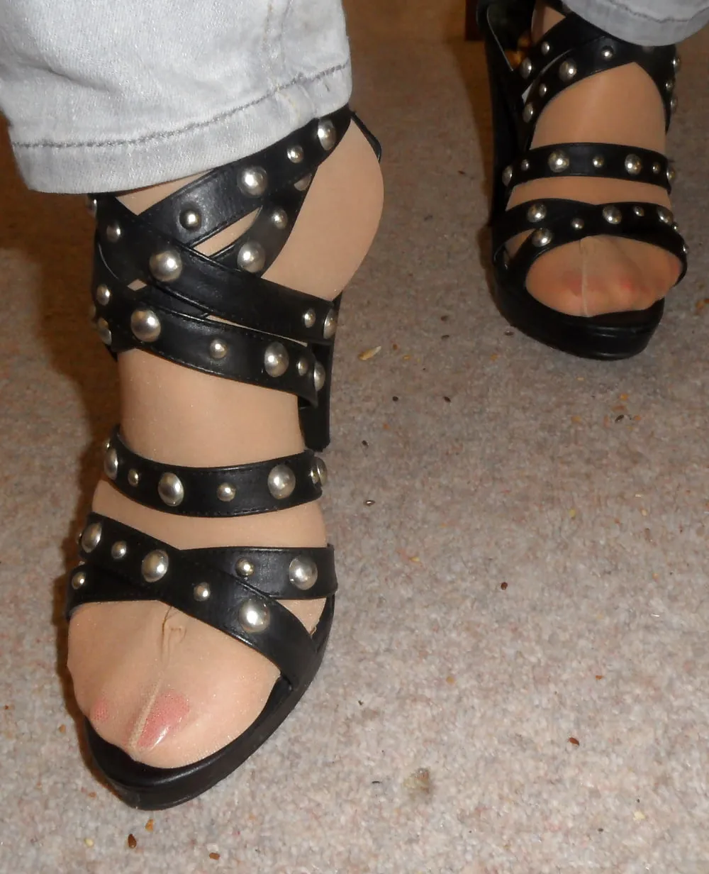 studded high heels of my wife with painted toenails