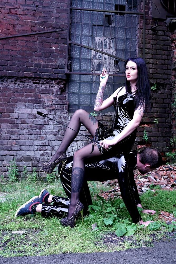 Dominatrix Nika on a walk with her slave. #16