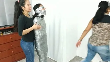 heavily duct tape mummified by crazy bondage women         