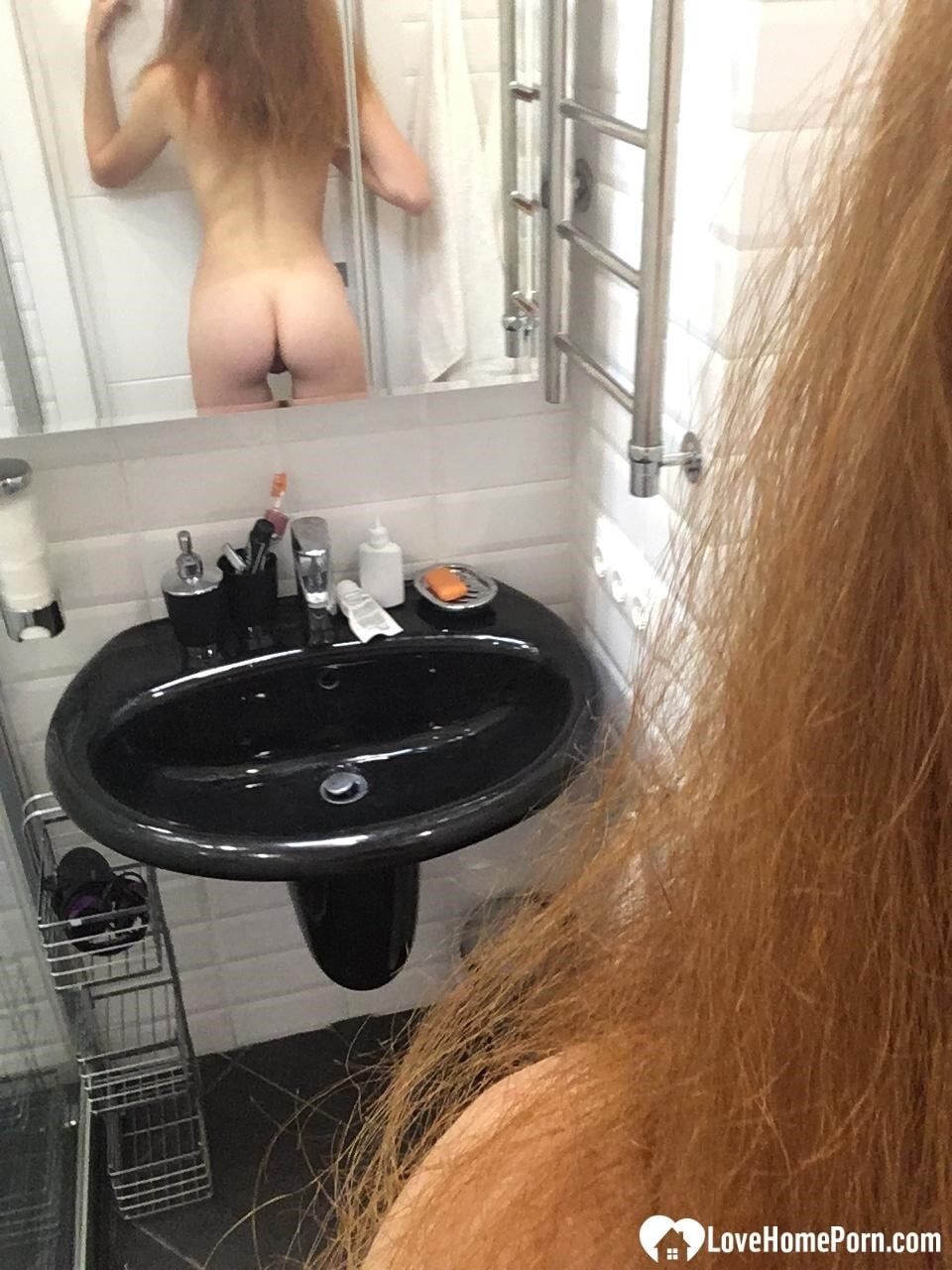 Messy redhead takes nudes in a public shower #23