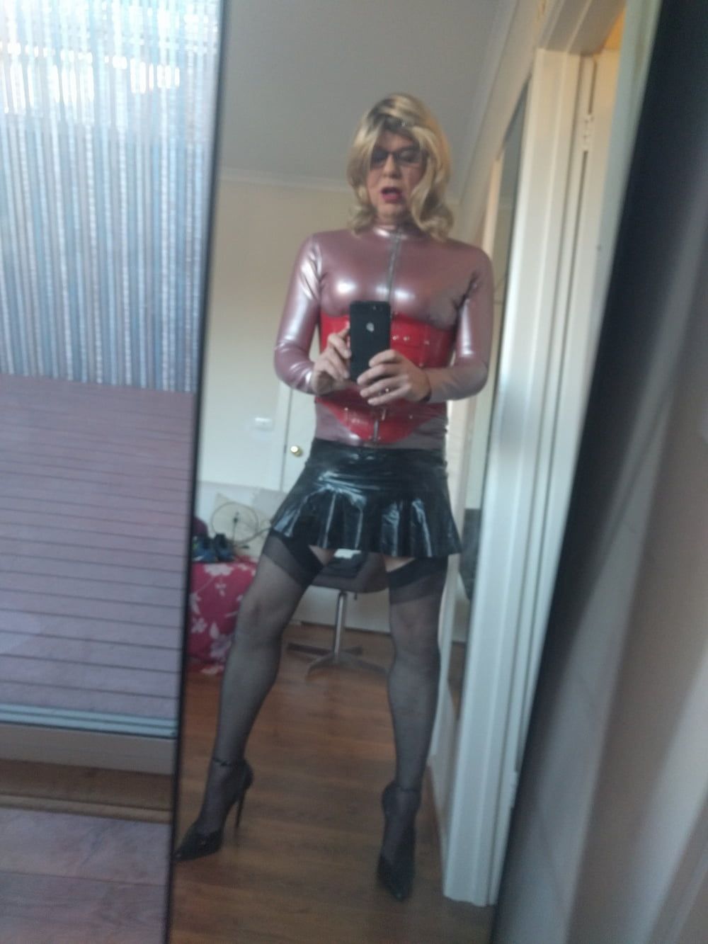 Back as a short blonde latex girl #7
