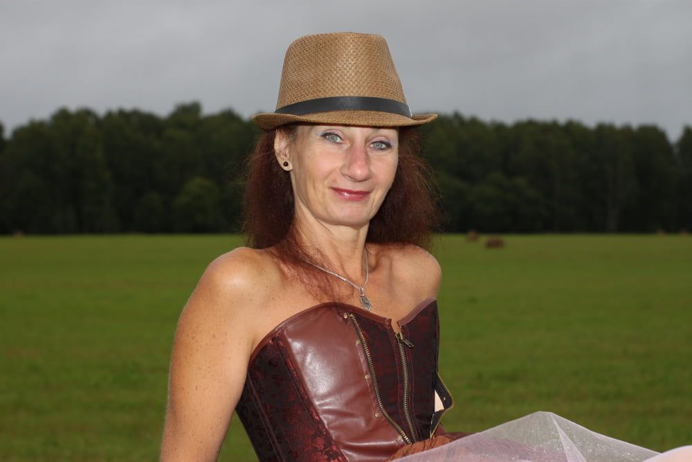 Rainy day in meadow and woman