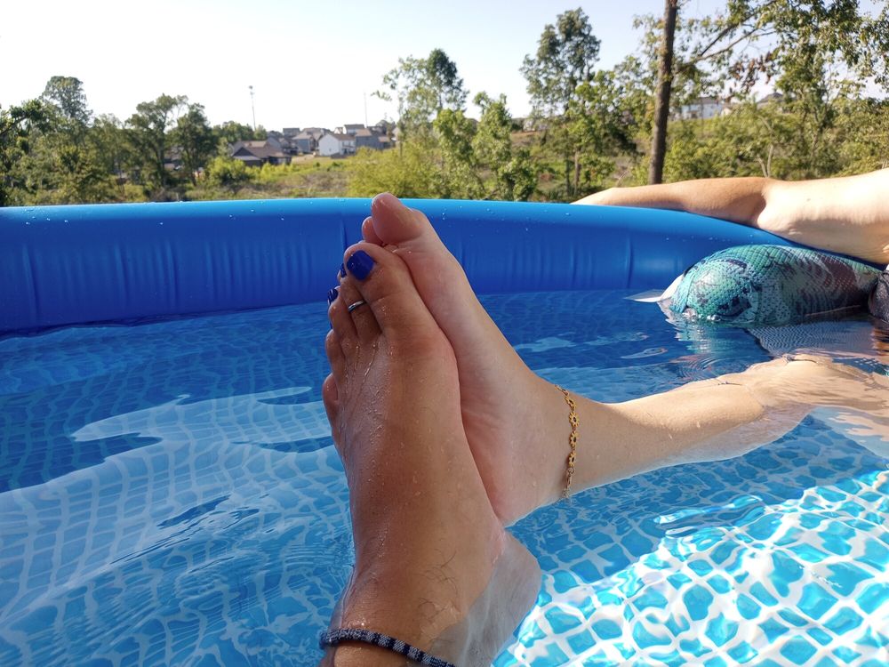 Showing off our pedicures in the pool #23