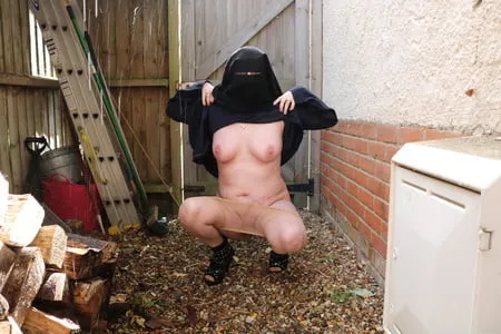 burqa outdoors flashing in the rain         