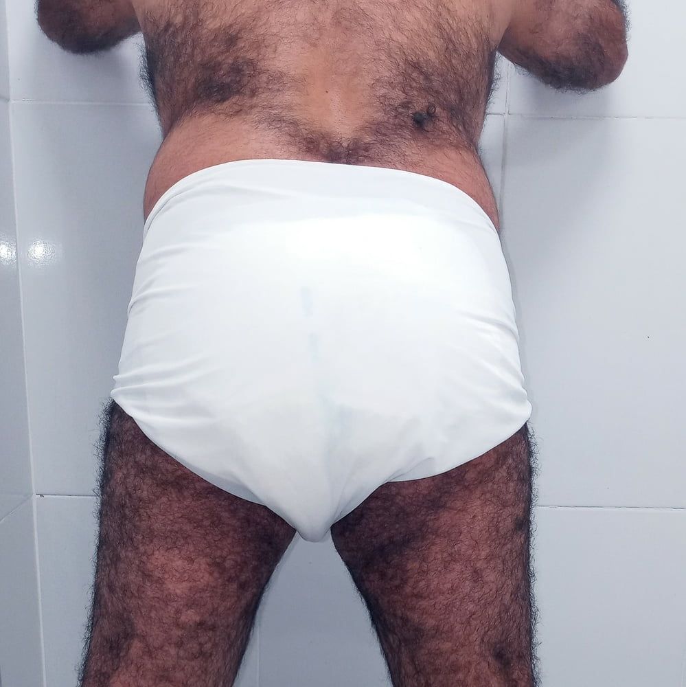 SHOWING WHITE DIAPER IN WORK BATHROOM. #12