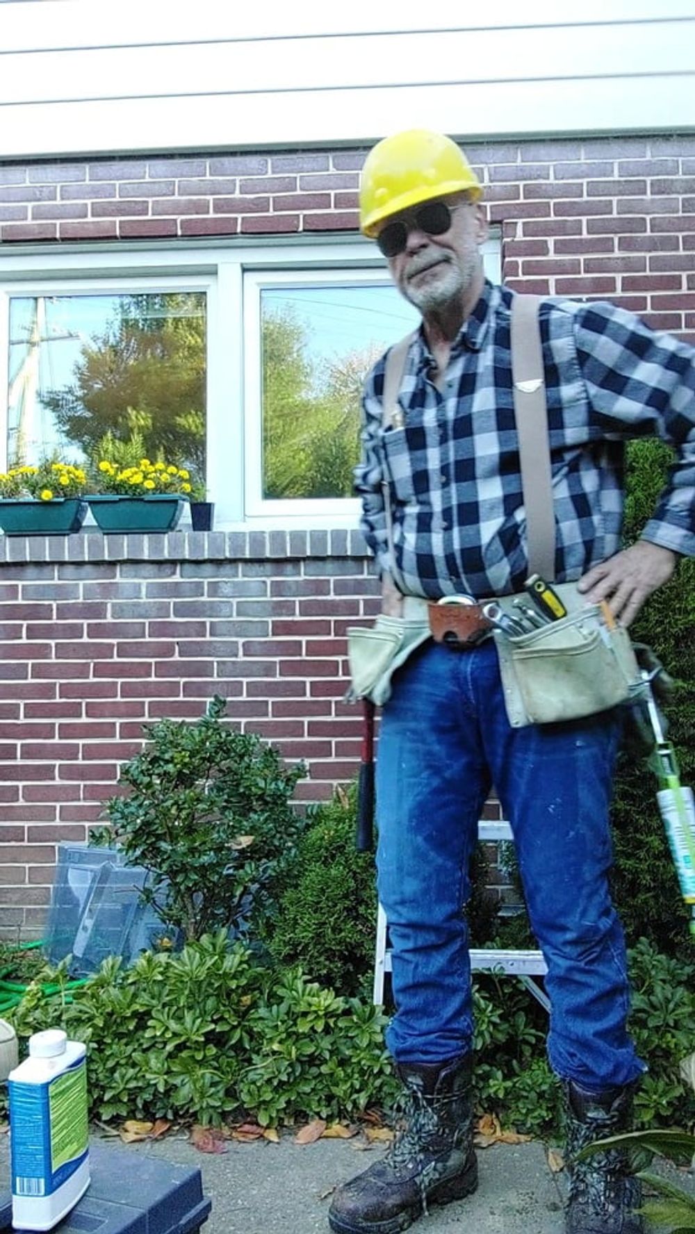 Construction dad inspecting windows