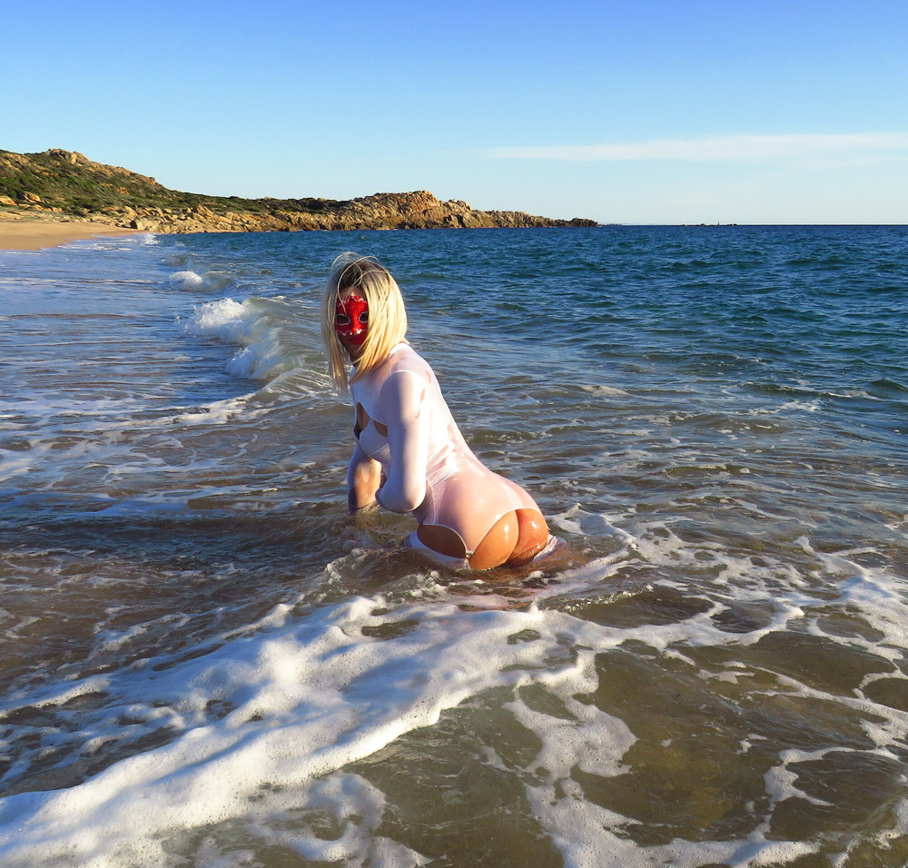 Sexy MILF Blonde shows off her ass on the beach. #24