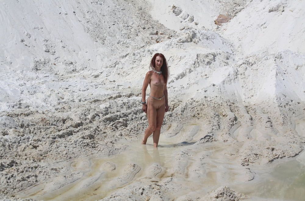 Bathing in white clay quarry