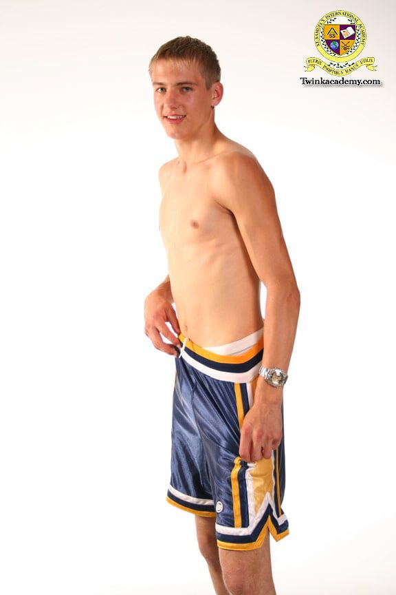 Blond teenage Latvian hunk poses in his basketball uniform #6