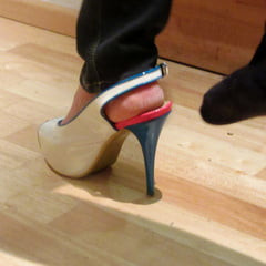 high heel exercise: she is standng on one leg 