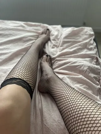 foot with fishnet socks         