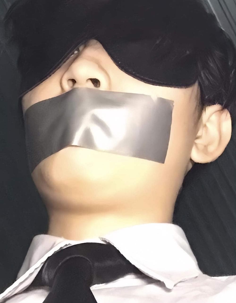 Wearing a white shirt and shiny black tie, gagged with duct  #4