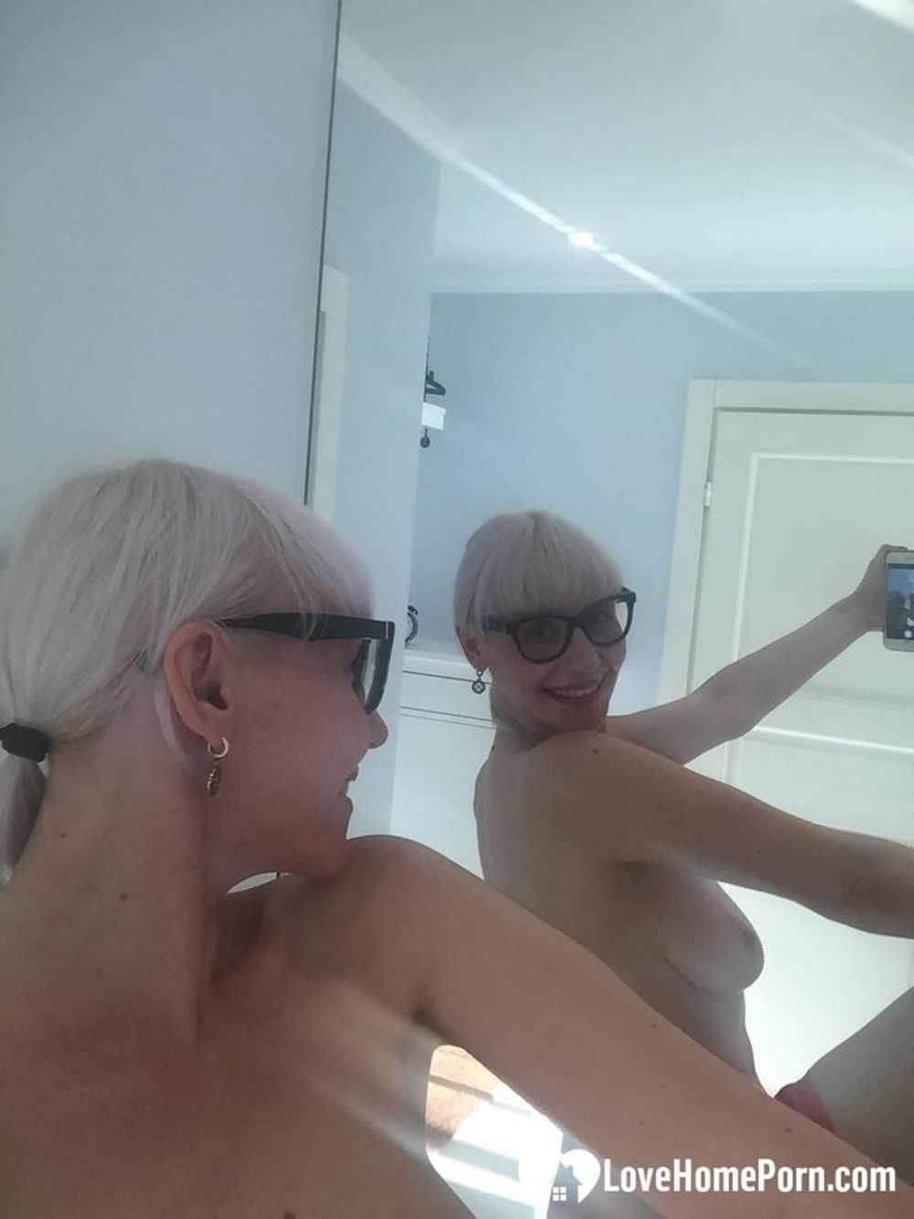 Blonde MILF with glasses teasing with nudes #28