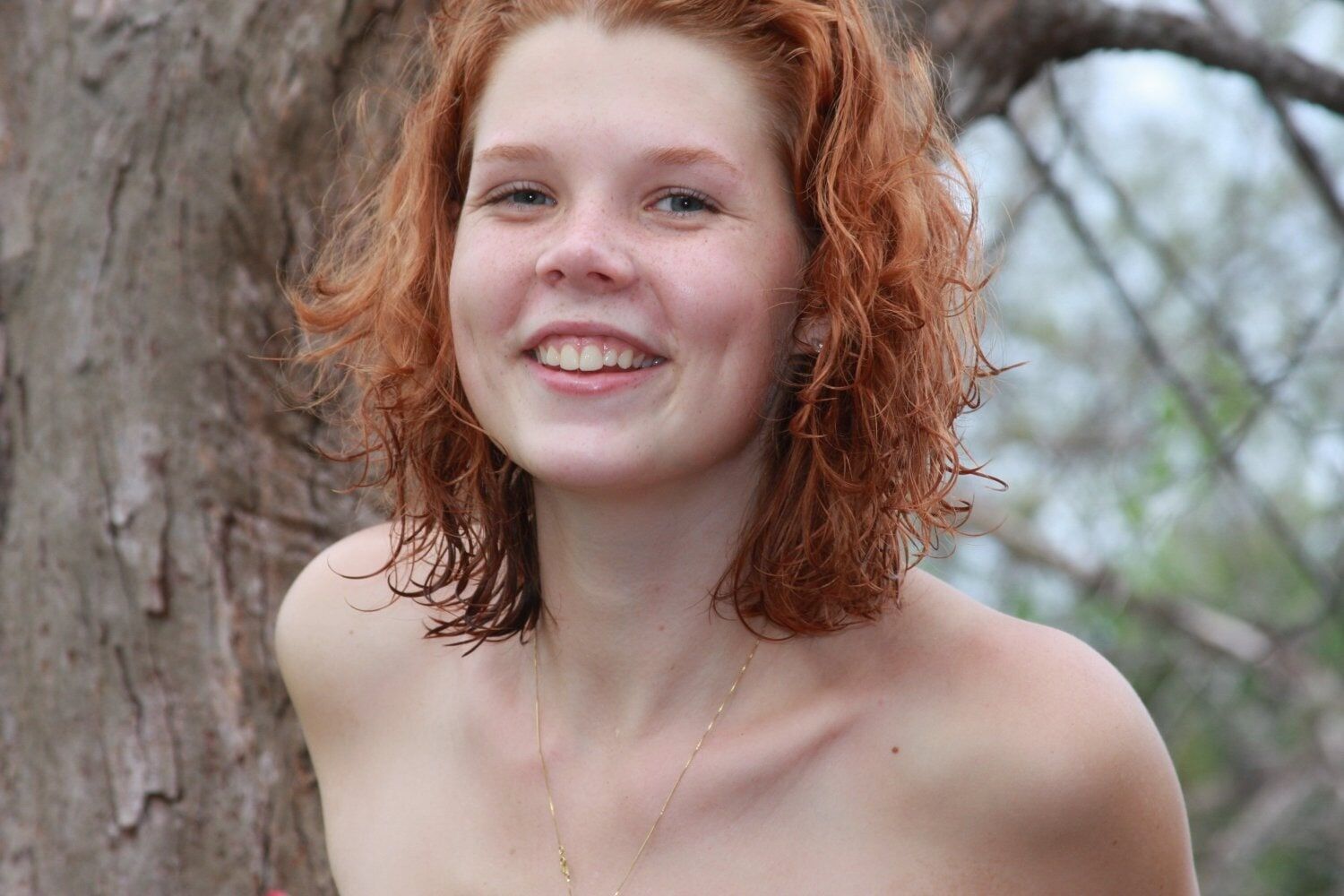 Gorgeous freckled redhead Tori posing nude in the beach