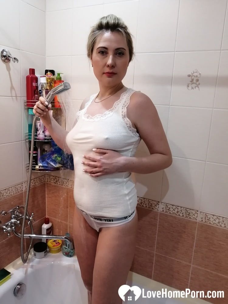 Naughty MILF masturbating during her hot bath #38