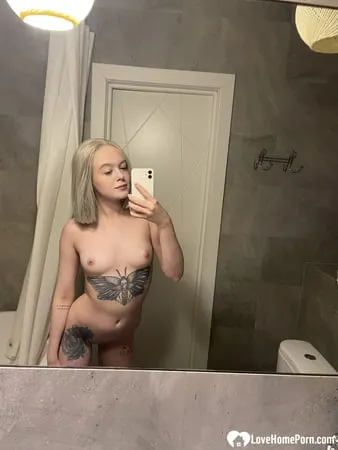 tattooed blonde showing off her sexy tattoos         