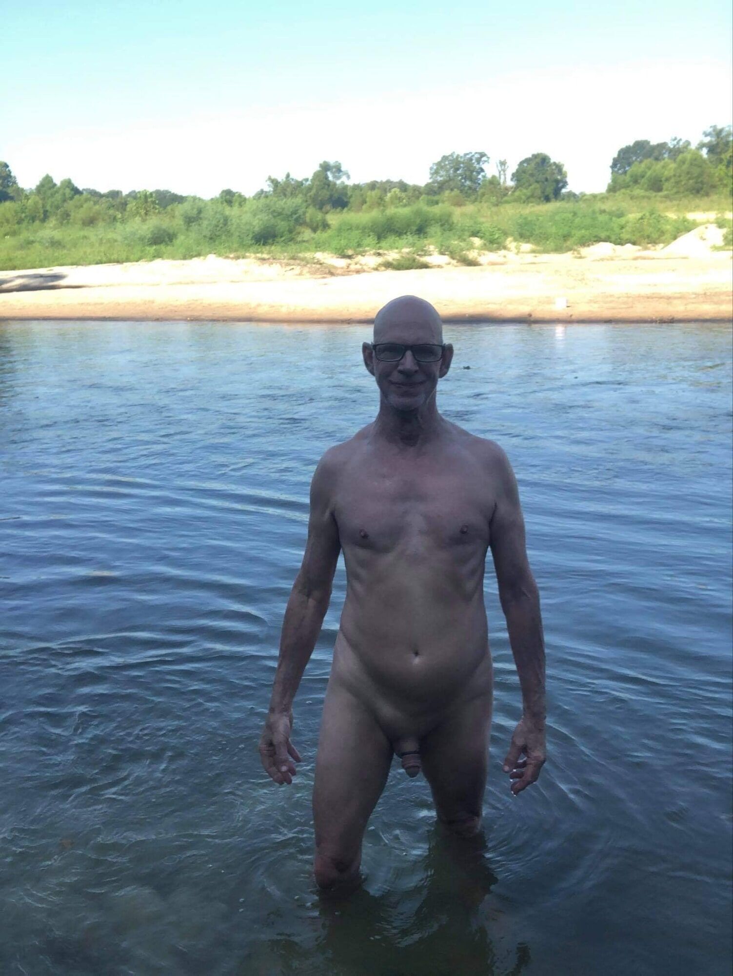 Naked at the public park river 