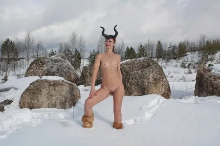 naked on snow in quarry         