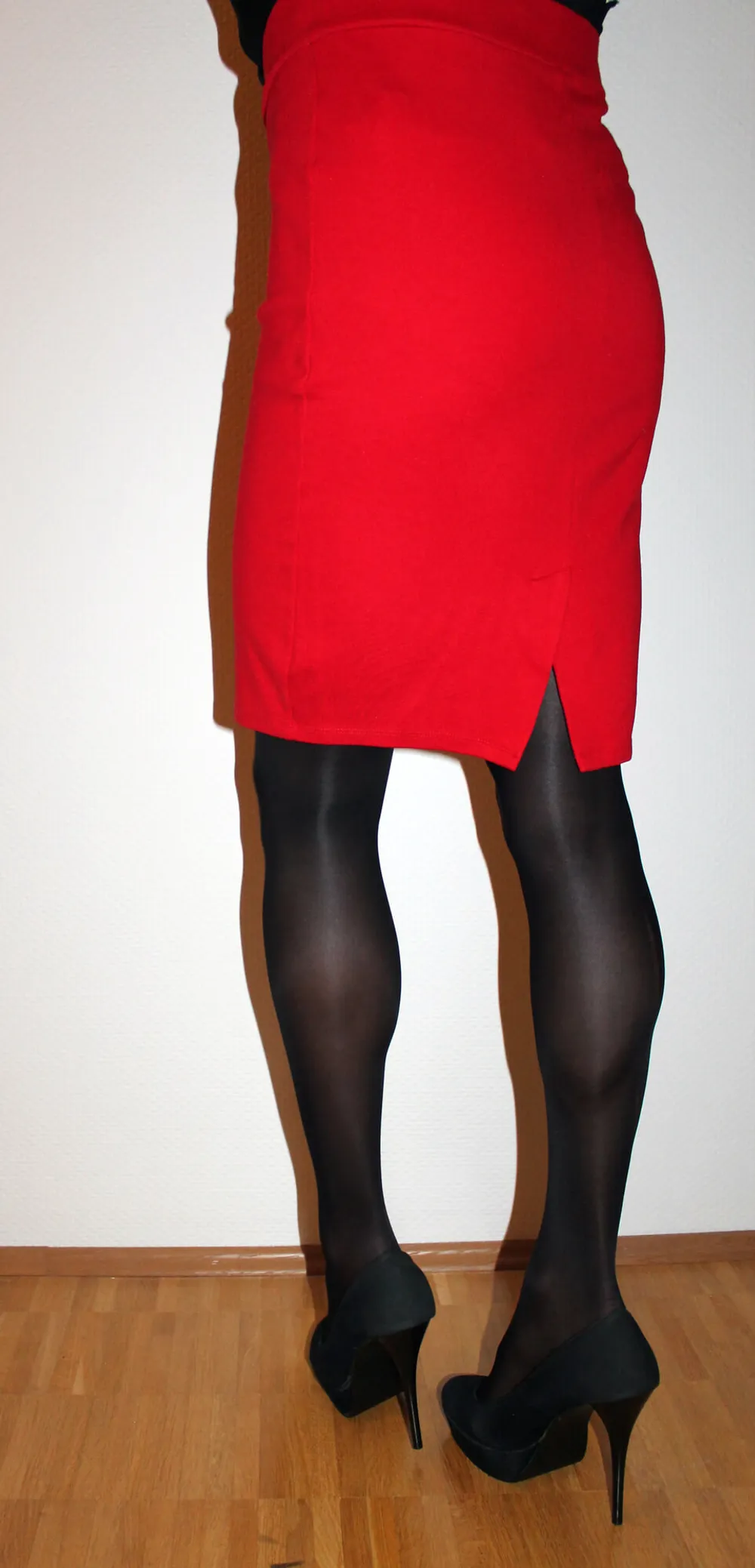 Red miniskirt and black pantyhose