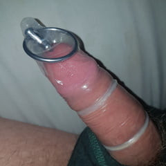 Deep sounding, urethral sounding inside condom covered cock