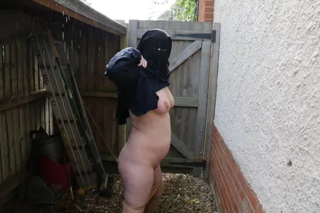 burqa outdoors flashing in the rain         