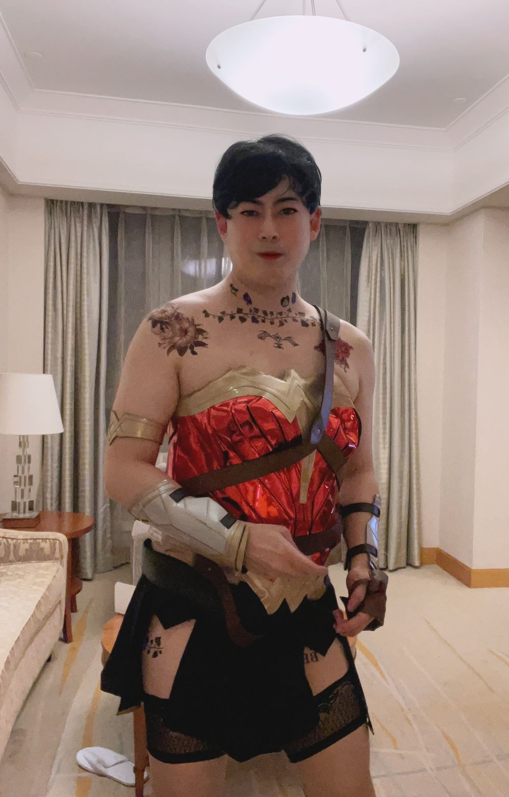 Asian sissy slut in wonder woman custome with tattoo