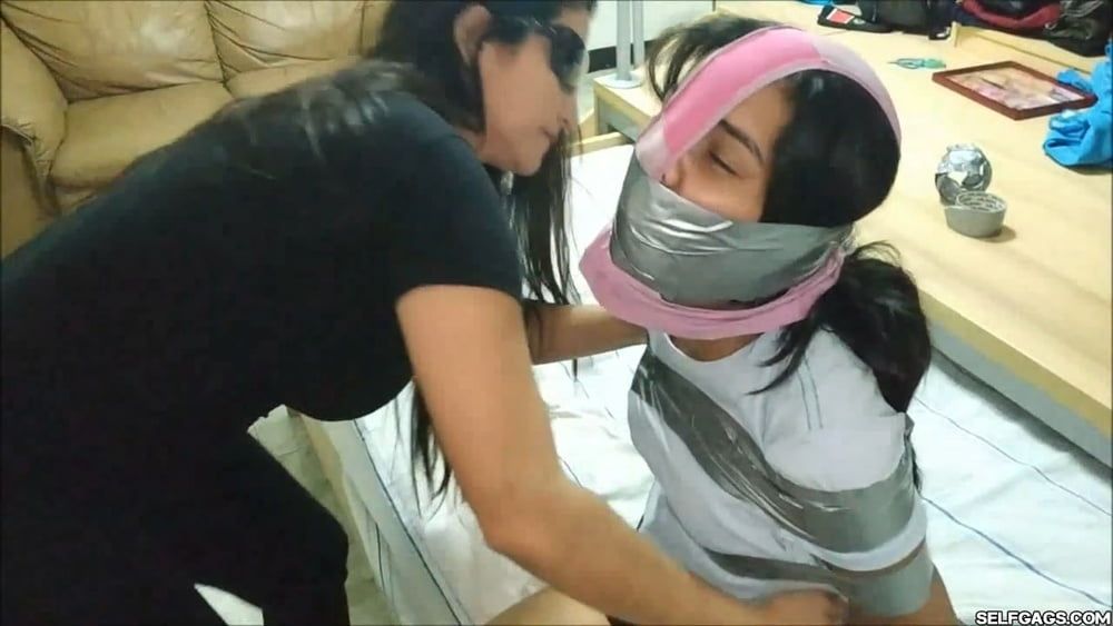 Panty Hooded Girl Gagged With Socks And Tape