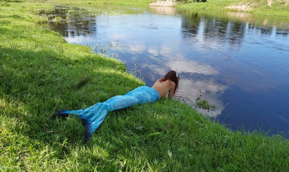 Mermaid plays with water #58