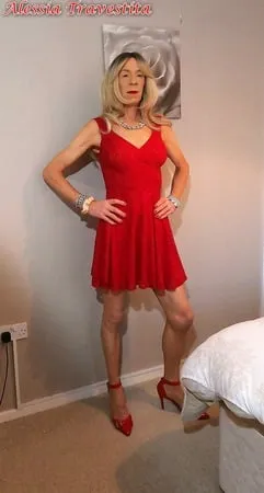    alessia travestita in flirty red dress         