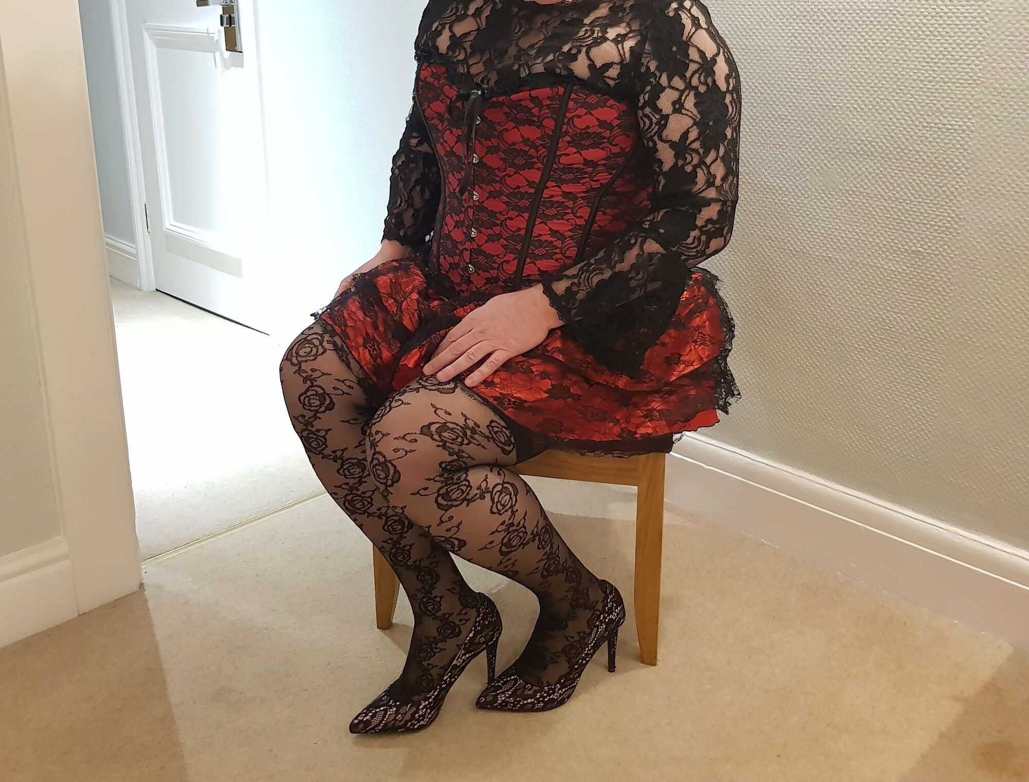 Crossdressing in floral lace lingerie, skirt and heels