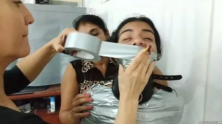 heavily duct tape mummified by crazy bondage women         