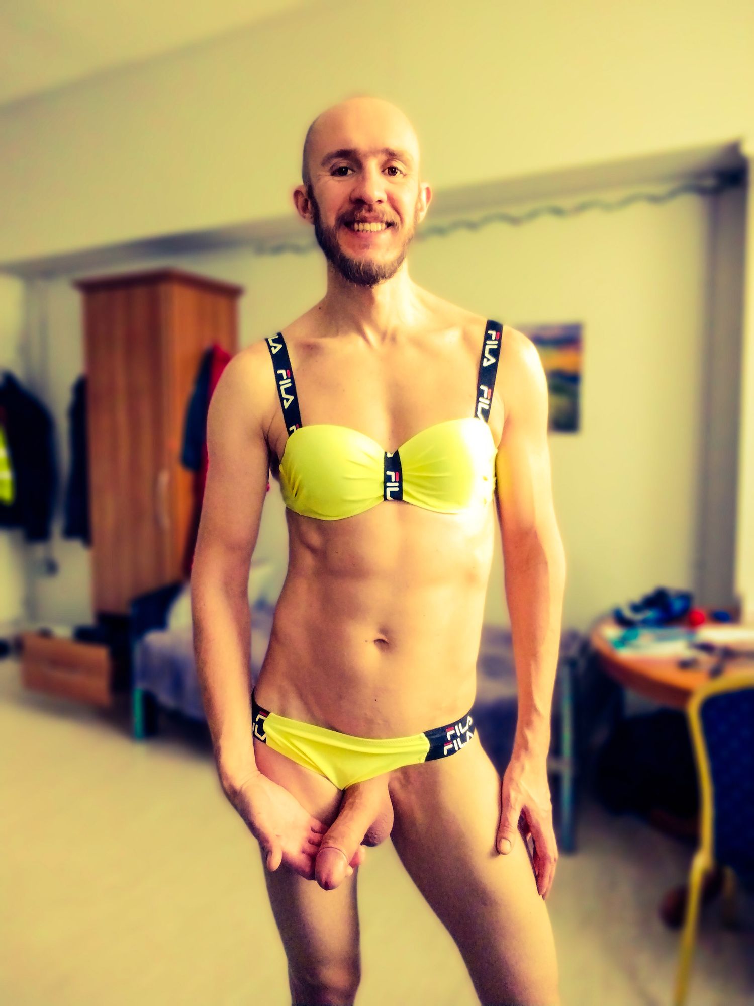 Bearded athletic man posing in yellow swimsuit  #8