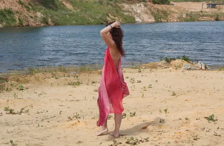 red shawl on white sand         