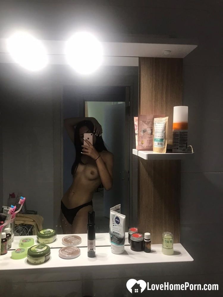 Hot schoolgirl reveals her tits in the mirror #2