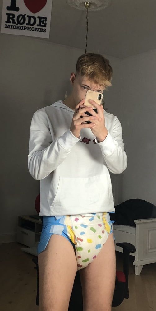 German padded boy shows his wet diaper