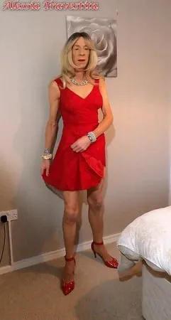    alessia travestita in flirty red dress         