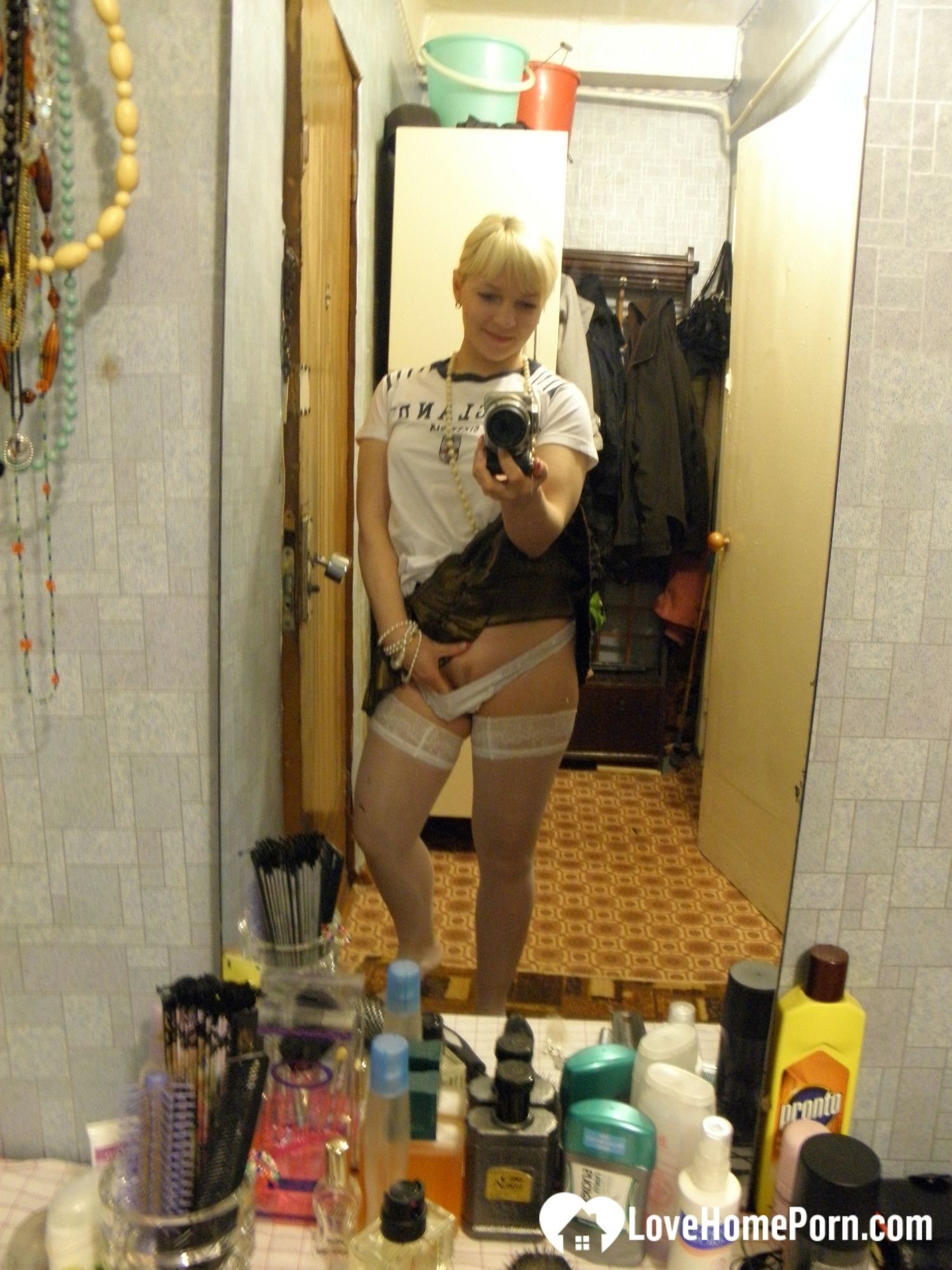 Aroused blonde in stockings taking naughty selfies #10