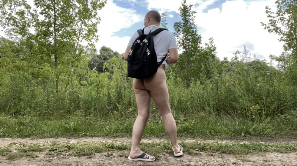 A photo of a naked walk in the summer forest #11