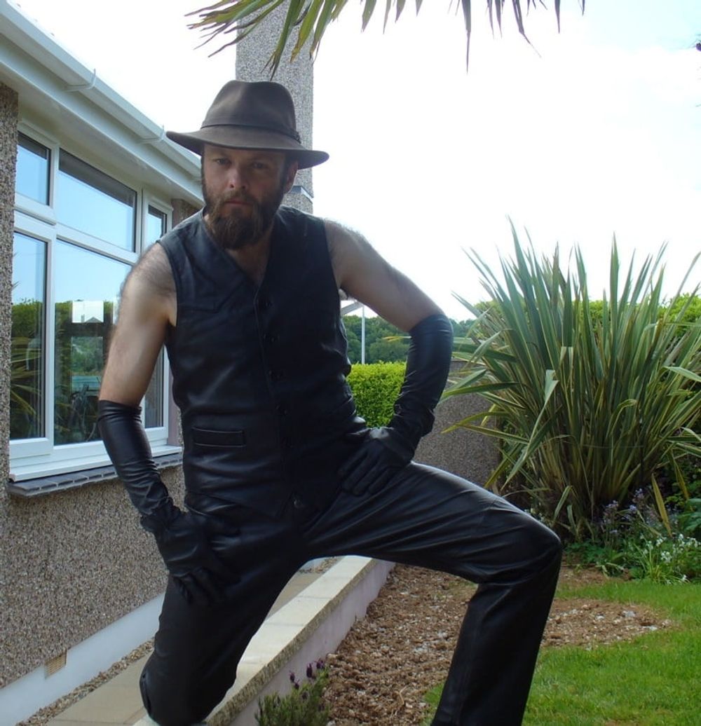 Leather Master outdoors posing in full leather