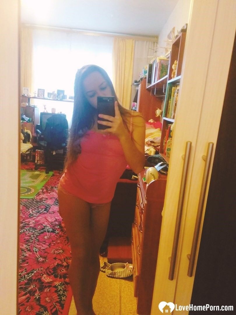 Cute teen shows off her curves sensually 