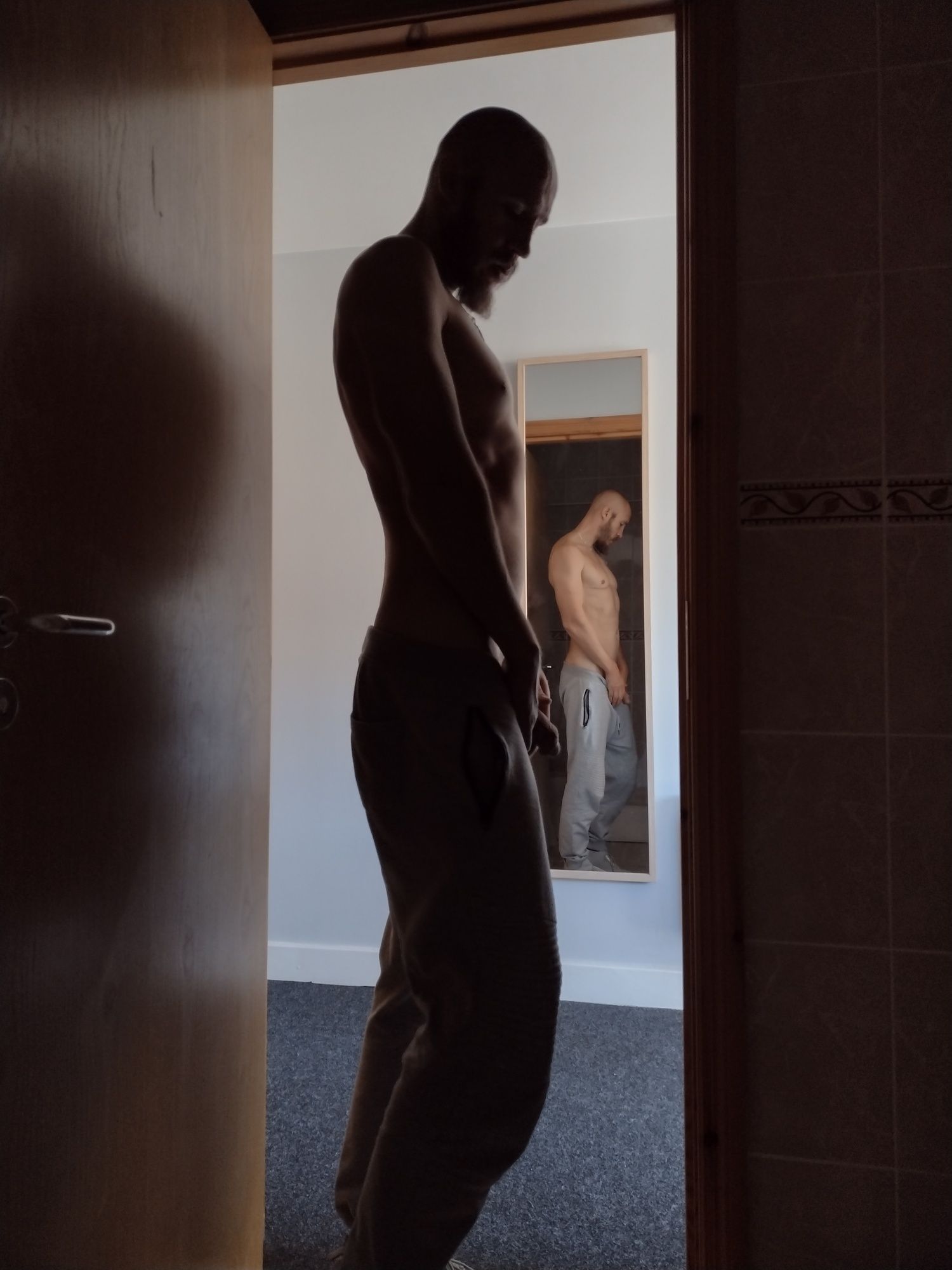 Posing nude in doorway #4
