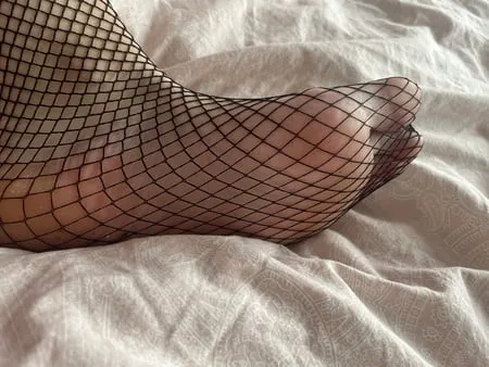 foot with fishnet socks         