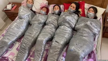   mummified girls barefoot in duct tape bondage         