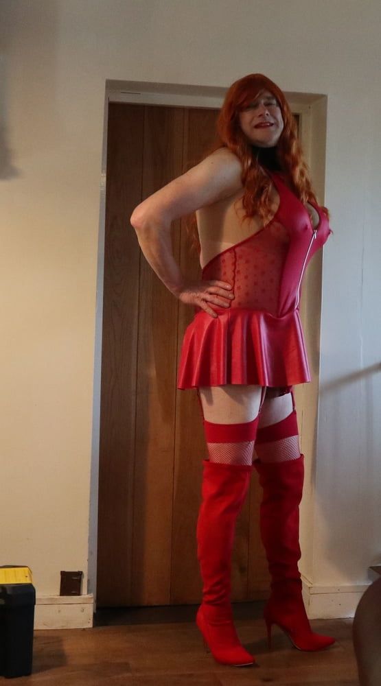 transgender in red lingerie and red thigh boots