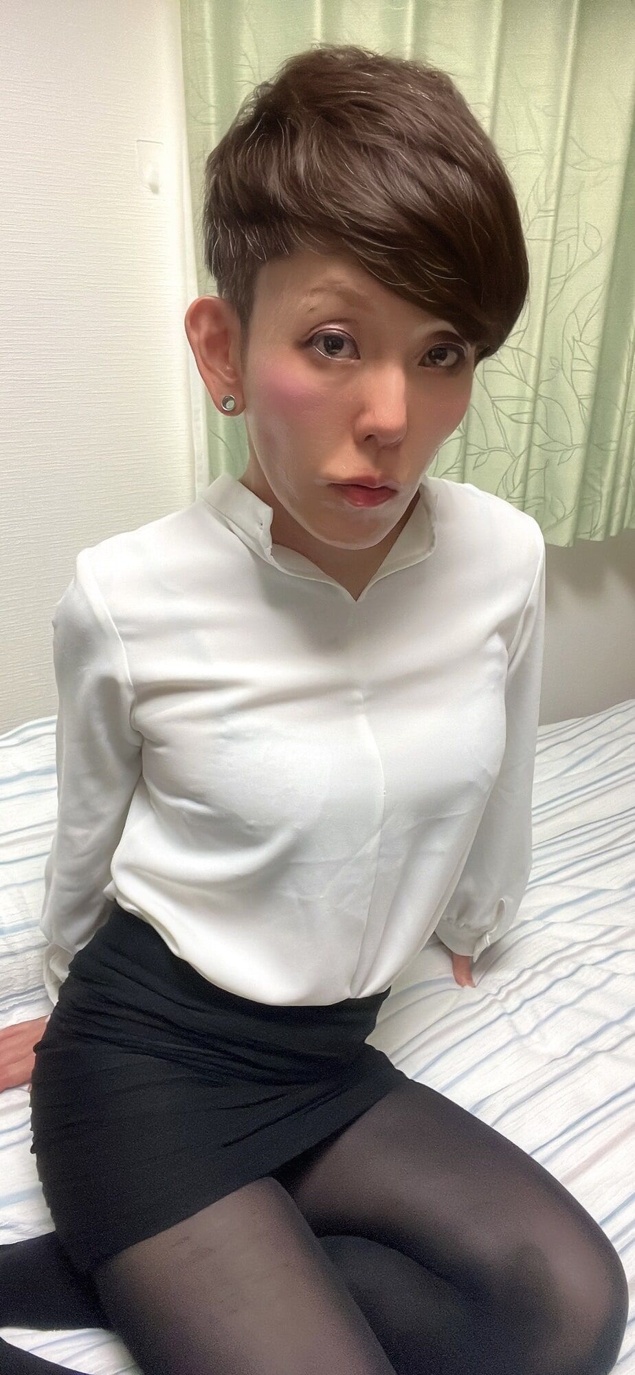 Serina wears white blouse and black tight skirt 