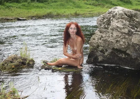 near a boulder in the river         