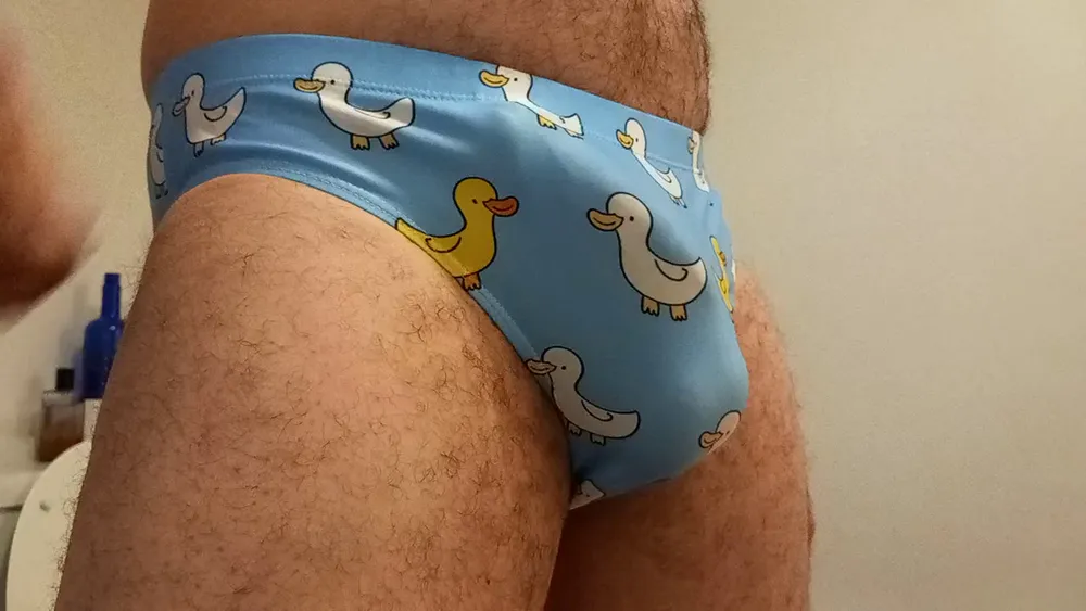 Small penis bulge cum in cute duck speedo, brief, trunks. #13