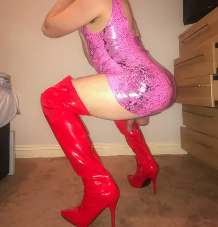 pink vinyl pvc snakeskin dress with red latex boots         