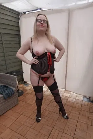 sexy basque heels and stockings and suspenders outdoors in t         